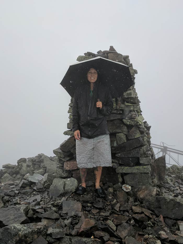 Christina on top of a mountain in the rain